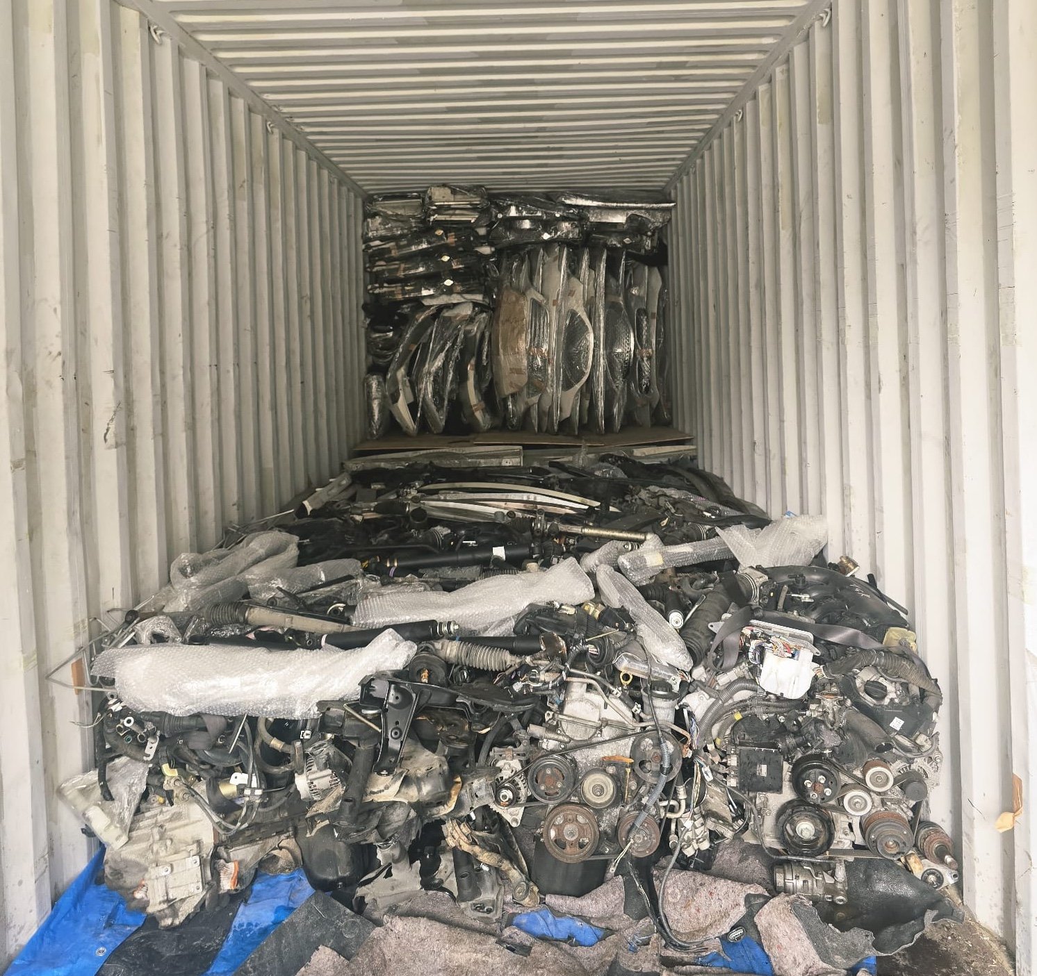container loaded with car engines and parts