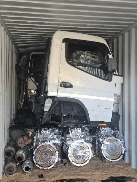Truck parts and components packed in container