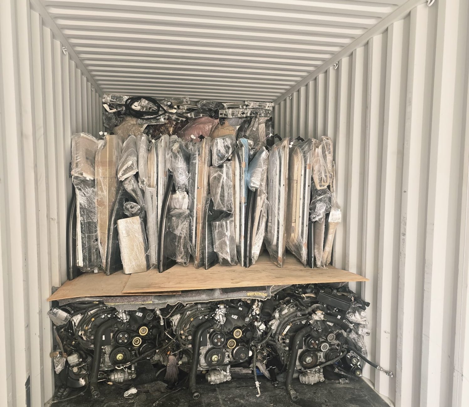 Container loaded with car parts