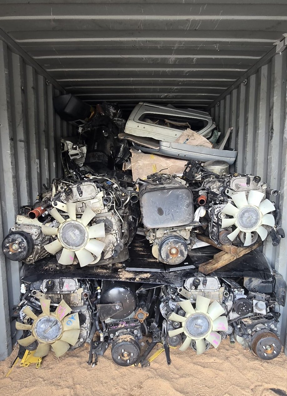 Container loaded with truck parts